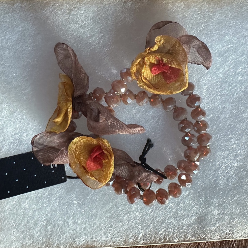 Pretty wrap bracelet with fabric flowers